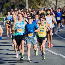 Runners participating in Bumrun Calgary charity 5K fundraising event supporting colon cancer screening