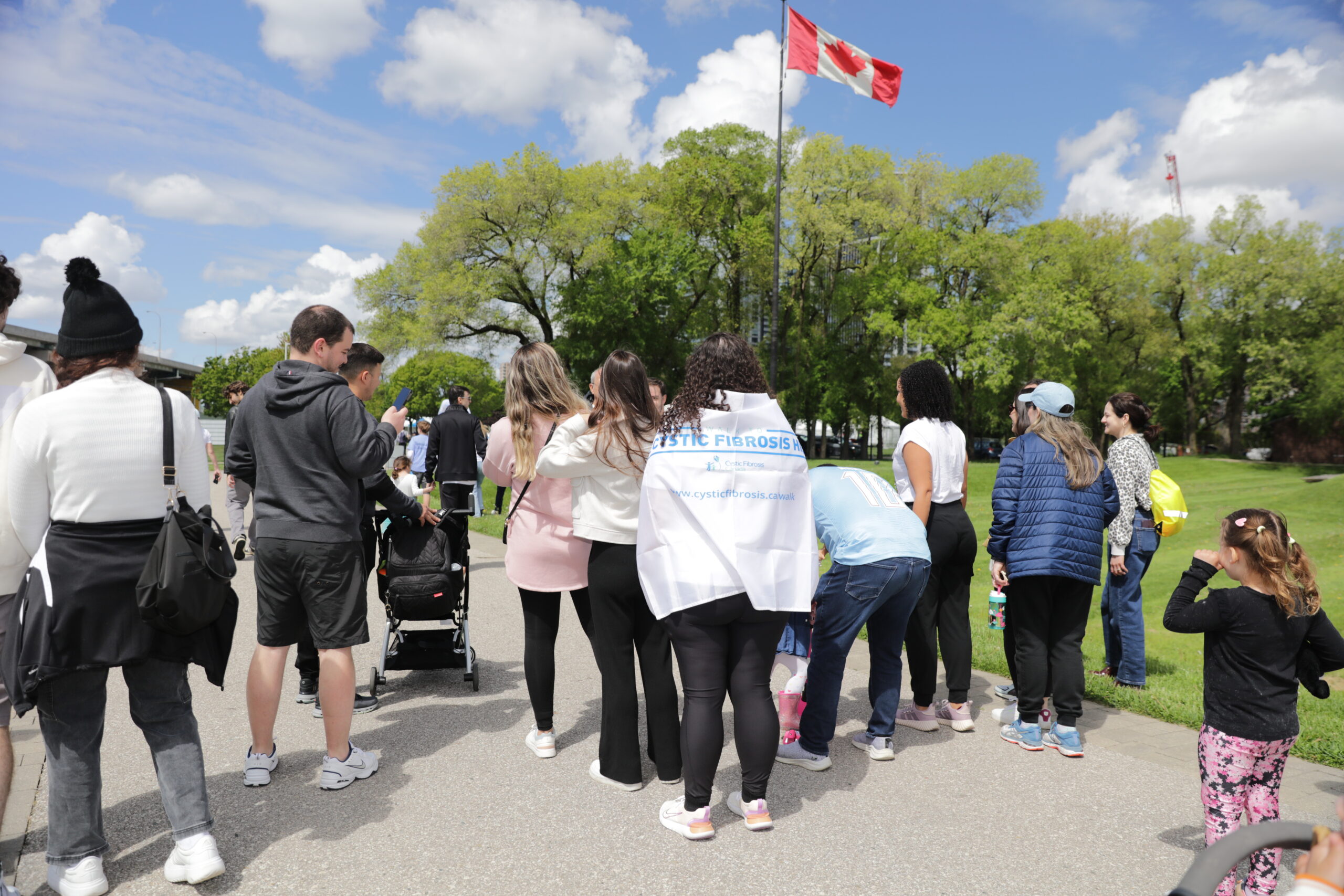 Participants walking together during the Walk To Make Cystic Fibrosis History charity fundraising event in Canada.